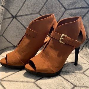 Brown open toe heels with strap.